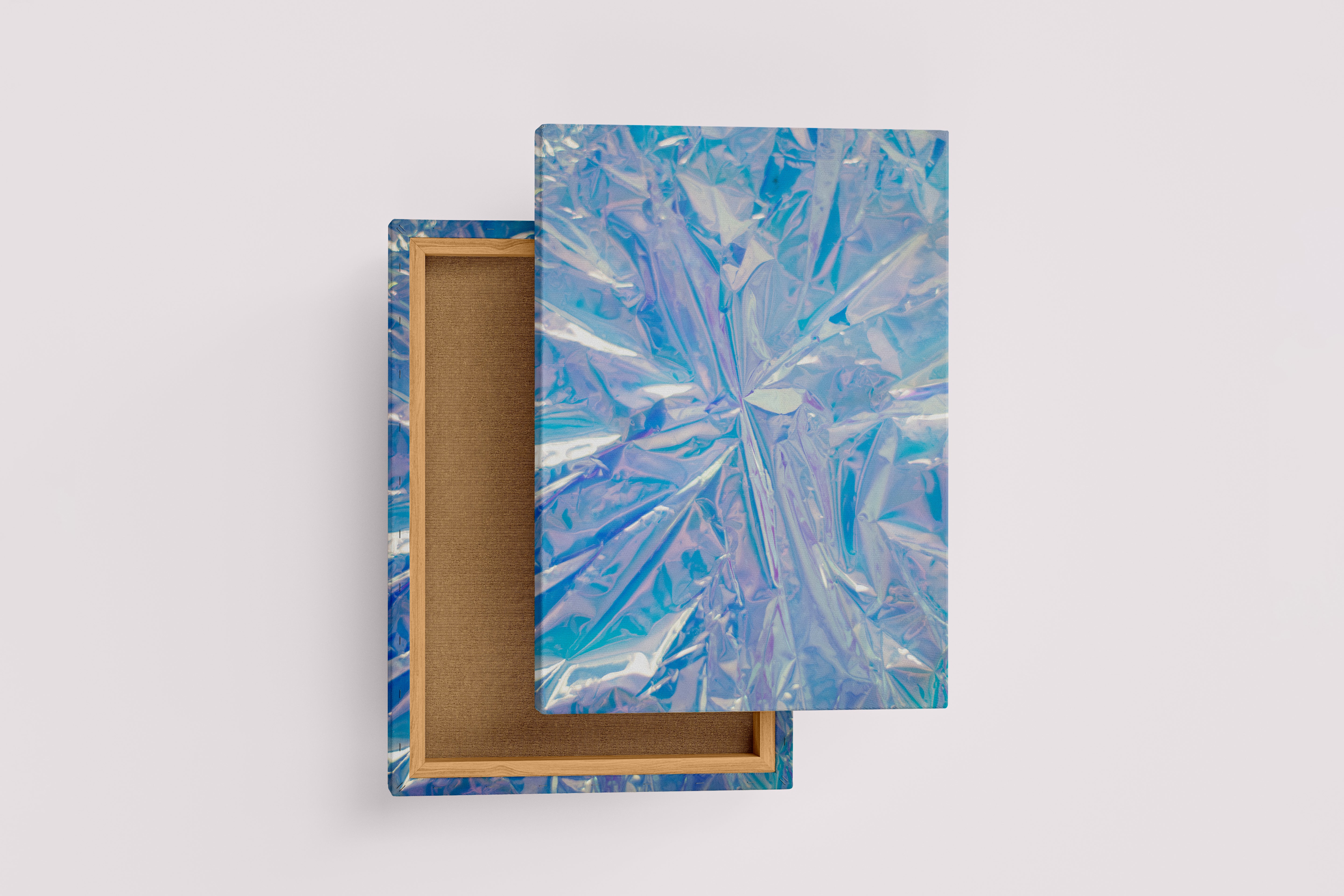 a close-up of a crumpled, futuristic holographic material with iridescent blue and purple reflections, abstract, art, kanvas tablo