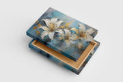 white lilies with gold leaf accents against a textured, dripping blue background, flower motif, art, kanvas tablo