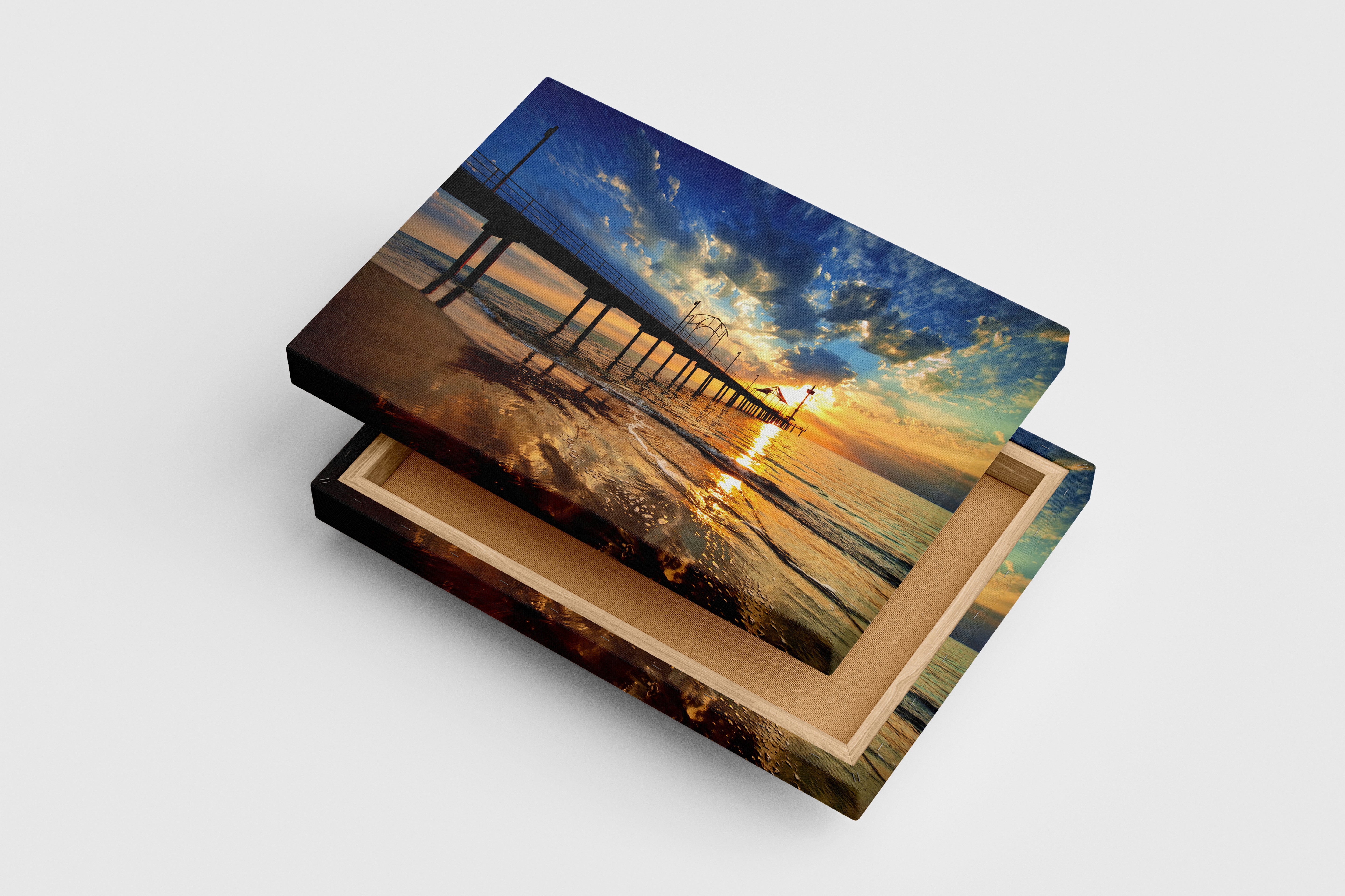 a pier on a beach under a dramatic sunset with golden reflections, view, art, kanvas tablo