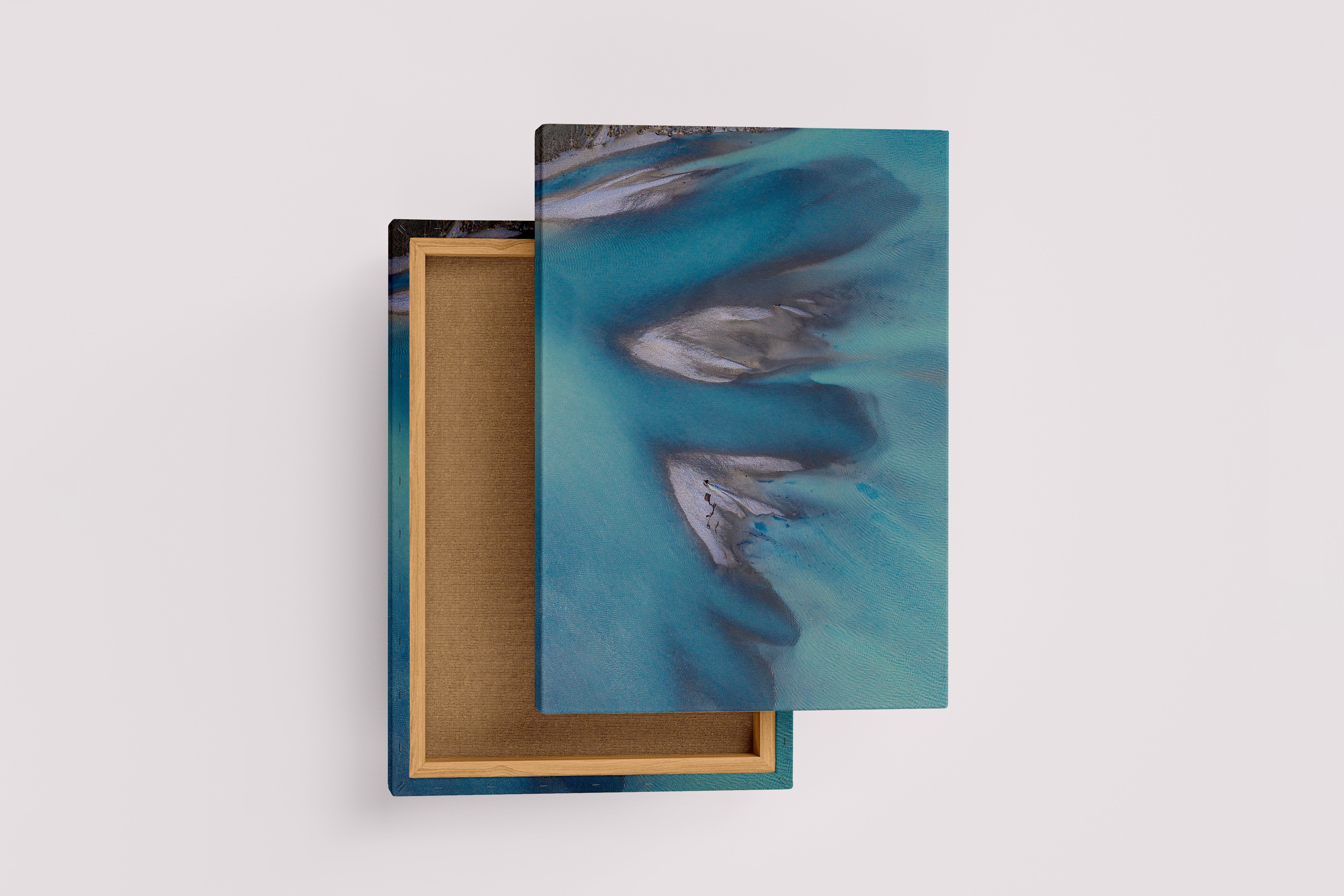 a minimalist aerial photograph of sandbars creating abstract shapes in calm, blue-grey water, abstract, art, kanvas tablo