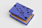 a minimalist abstract artwork with dynamic black paint splatters on a lavender background, abstract, art, kanvas tablo
