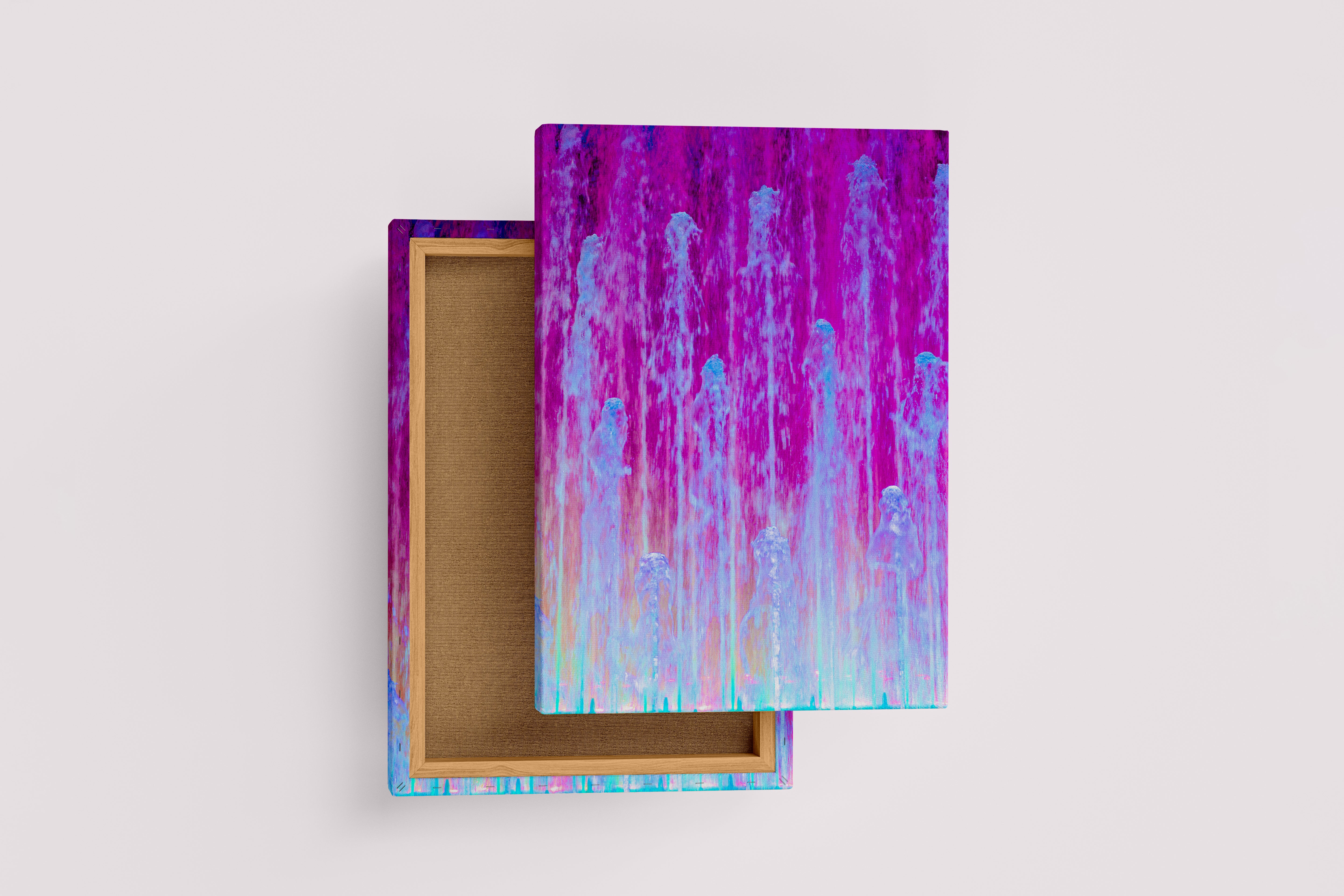 a vibrant night photograph of a water fountain illuminated with pink and blue lights, abstract, art, kanvas tablo