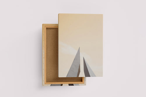 minimalist architectural photo of two sharp triangular structures against a warm pastel sky, abstract, art, kanvas tablo