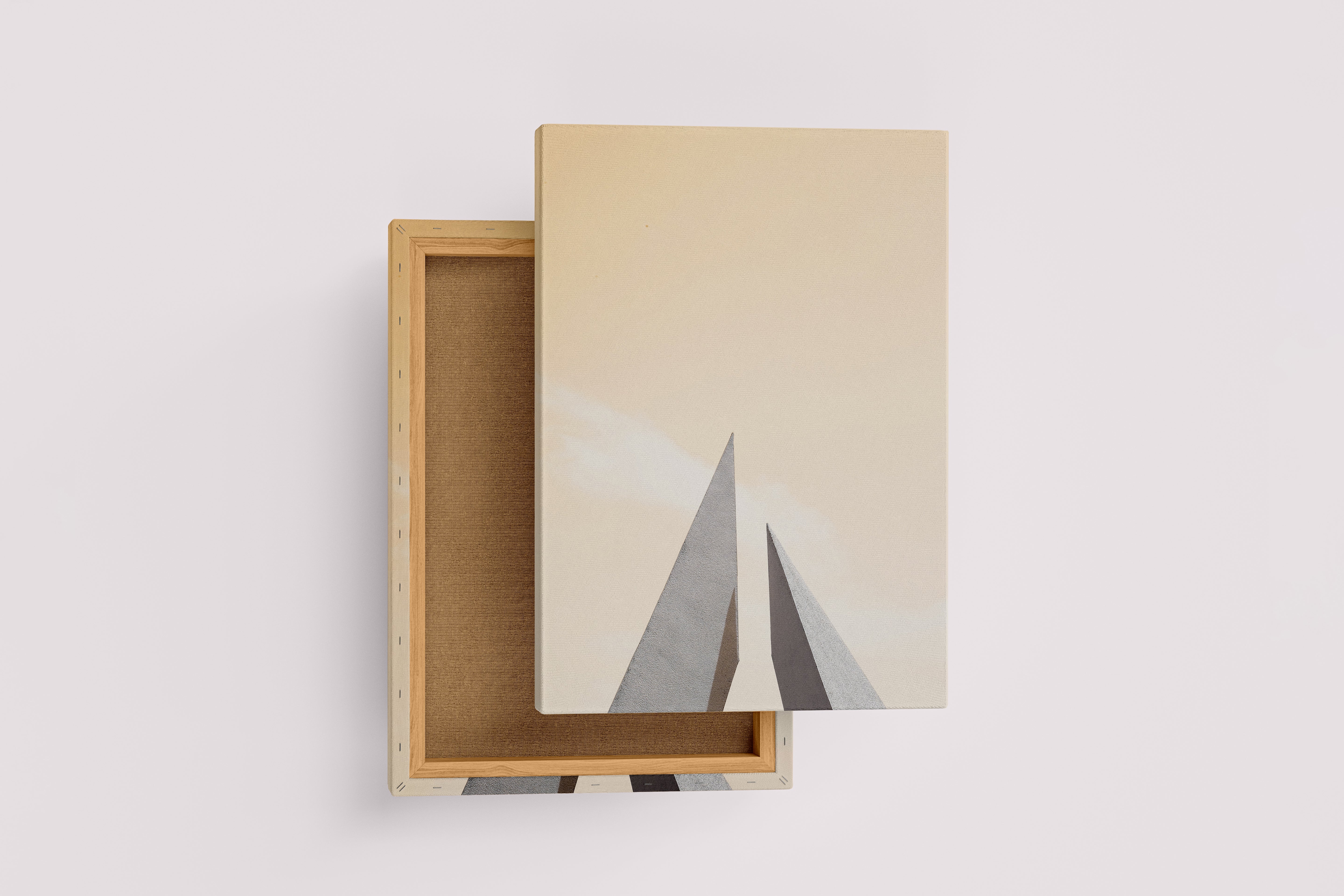minimalist architectural photo of two sharp triangular structures against a warm pastel sky, abstract, art, kanvas tablo