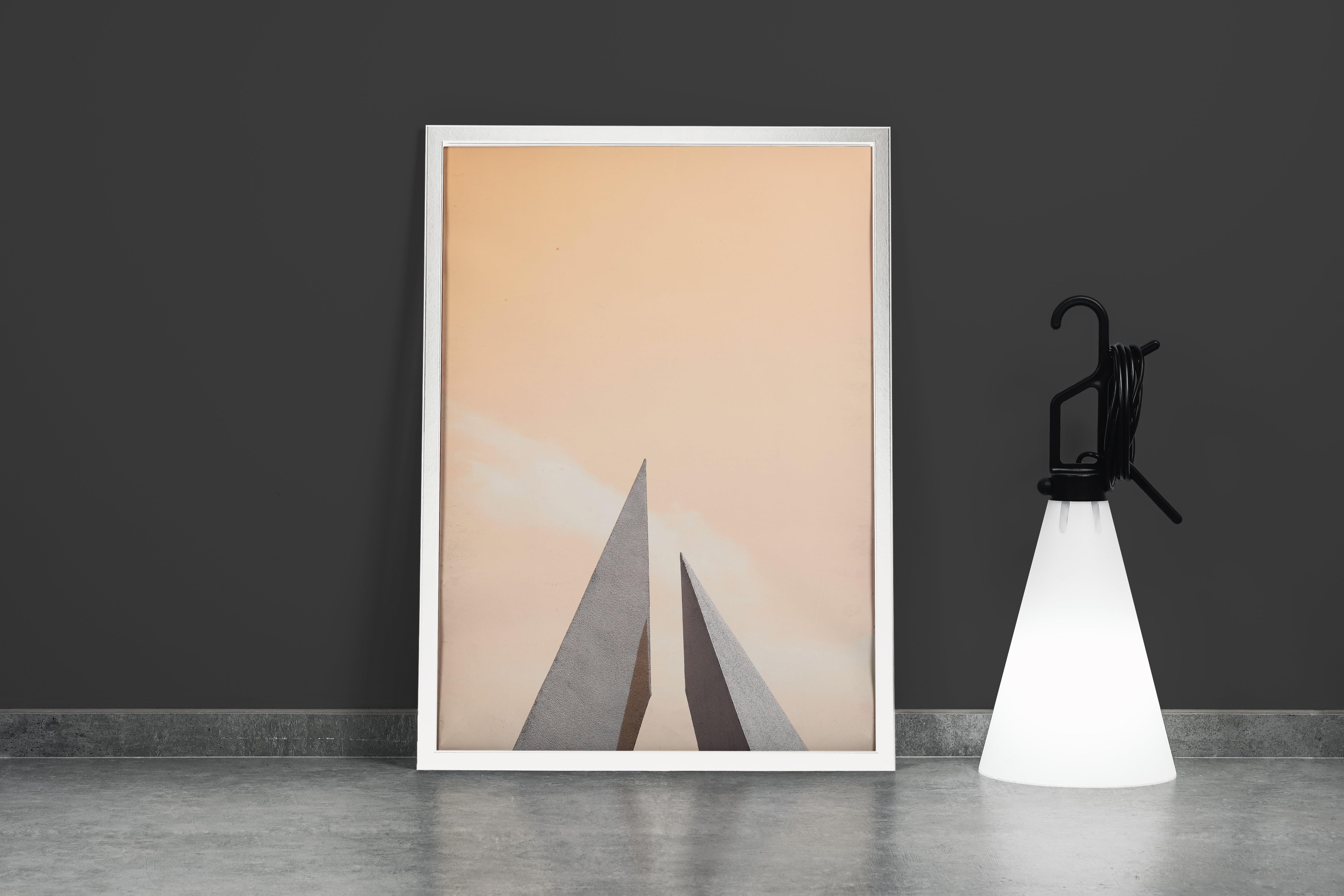 minimalist architectural photo of two sharp triangular structures against a warm pastel sky, abstract, art, kanvas tablo