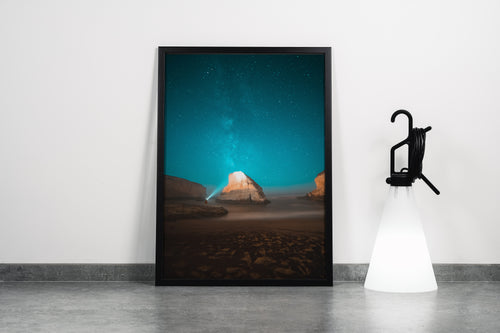 a man on a beach at night, illuminating a sea stack under the milky way, art, kanvas tablo