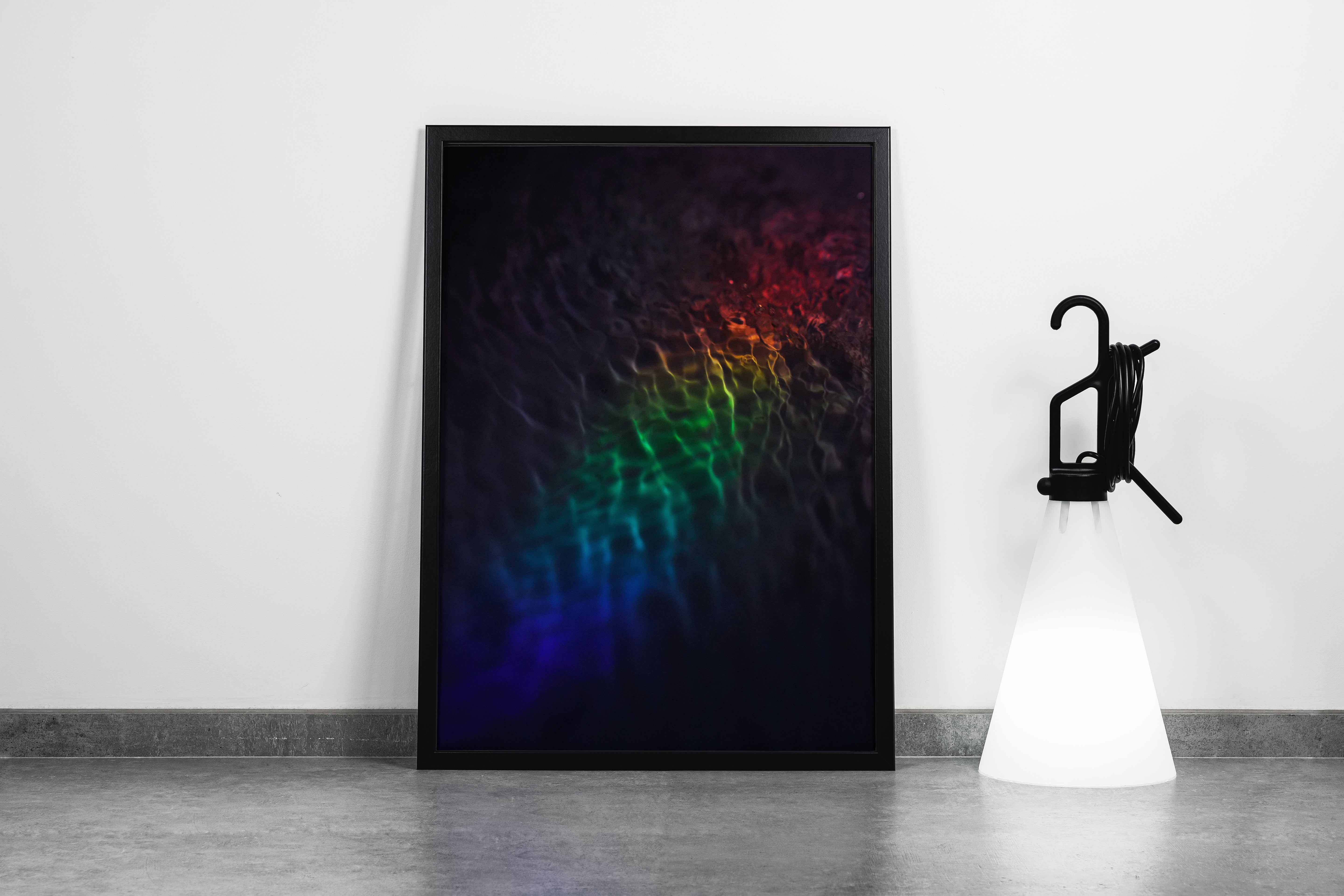 a subtle and dark photograph of rainbow-colored light refracting on gentle water ripples, abstract, art, kanvas tablo