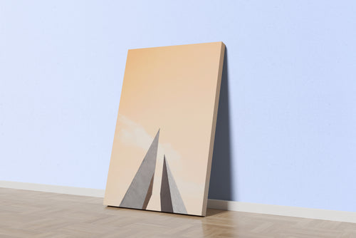 minimalist architectural photo of two sharp triangular structures against a warm pastel sky, abstract, art, kanvas tablo