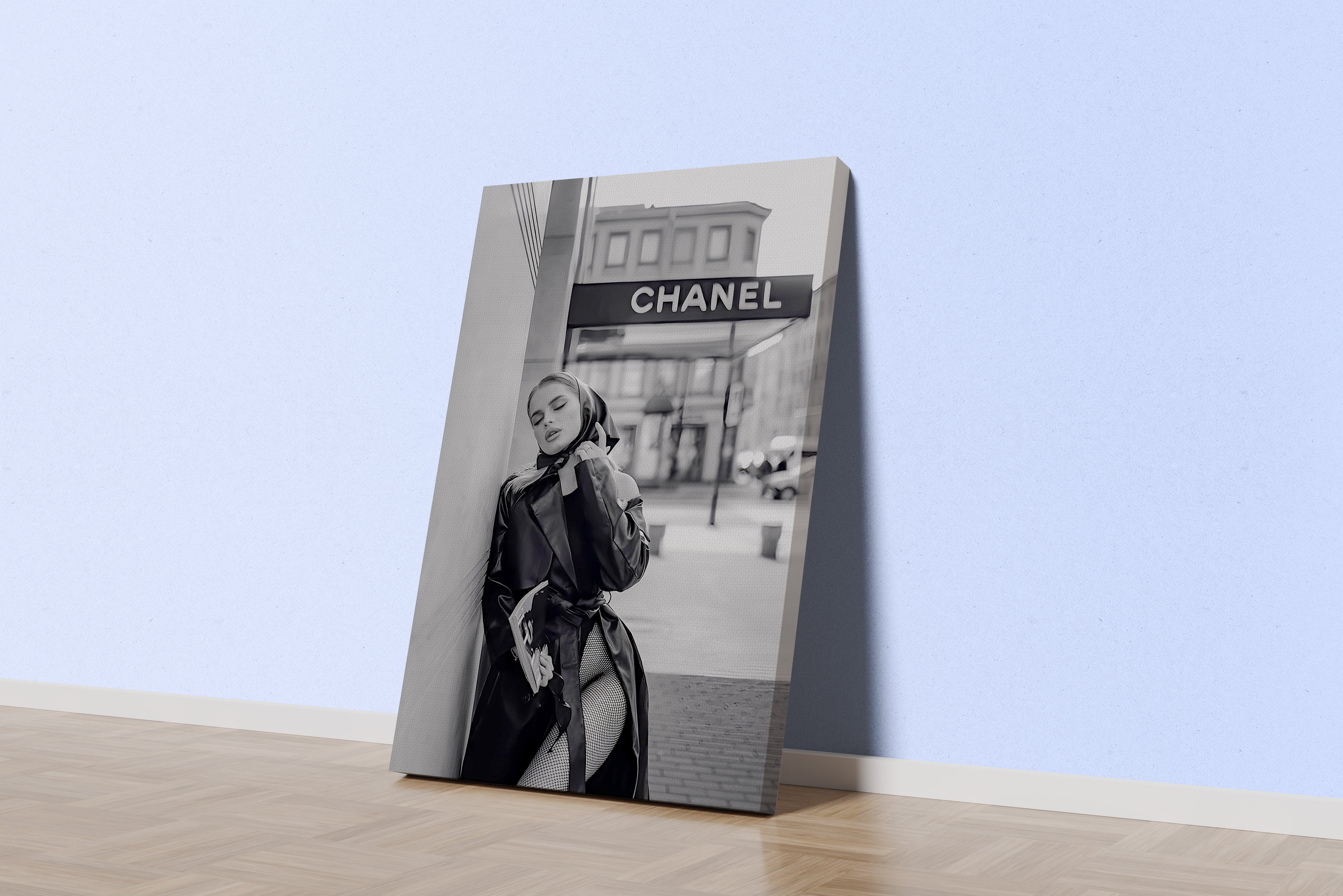 a black and white fashion photo of a woman posing under a chanel sign, art, kanvas tablo