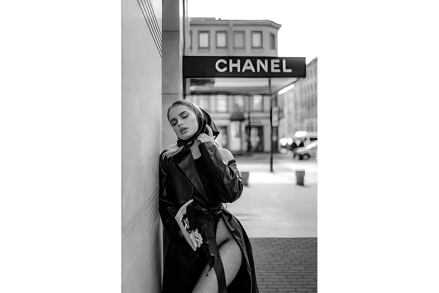 a black and white fashion photo of a woman posing under a chanel sign, art, kanvas tablo