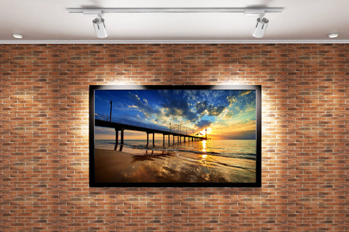 a pier on a beach under a dramatic sunset with golden reflections, view, art, kanvas tablo