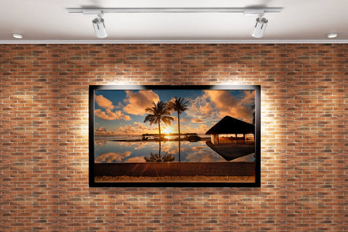 a serene infinity pool perfectly reflecting a golden sunset and two palm trees, view, art, kanvas tablo