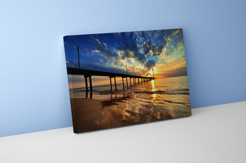a pier on a beach under a dramatic sunset with golden reflections, view, art, kanvas tablo