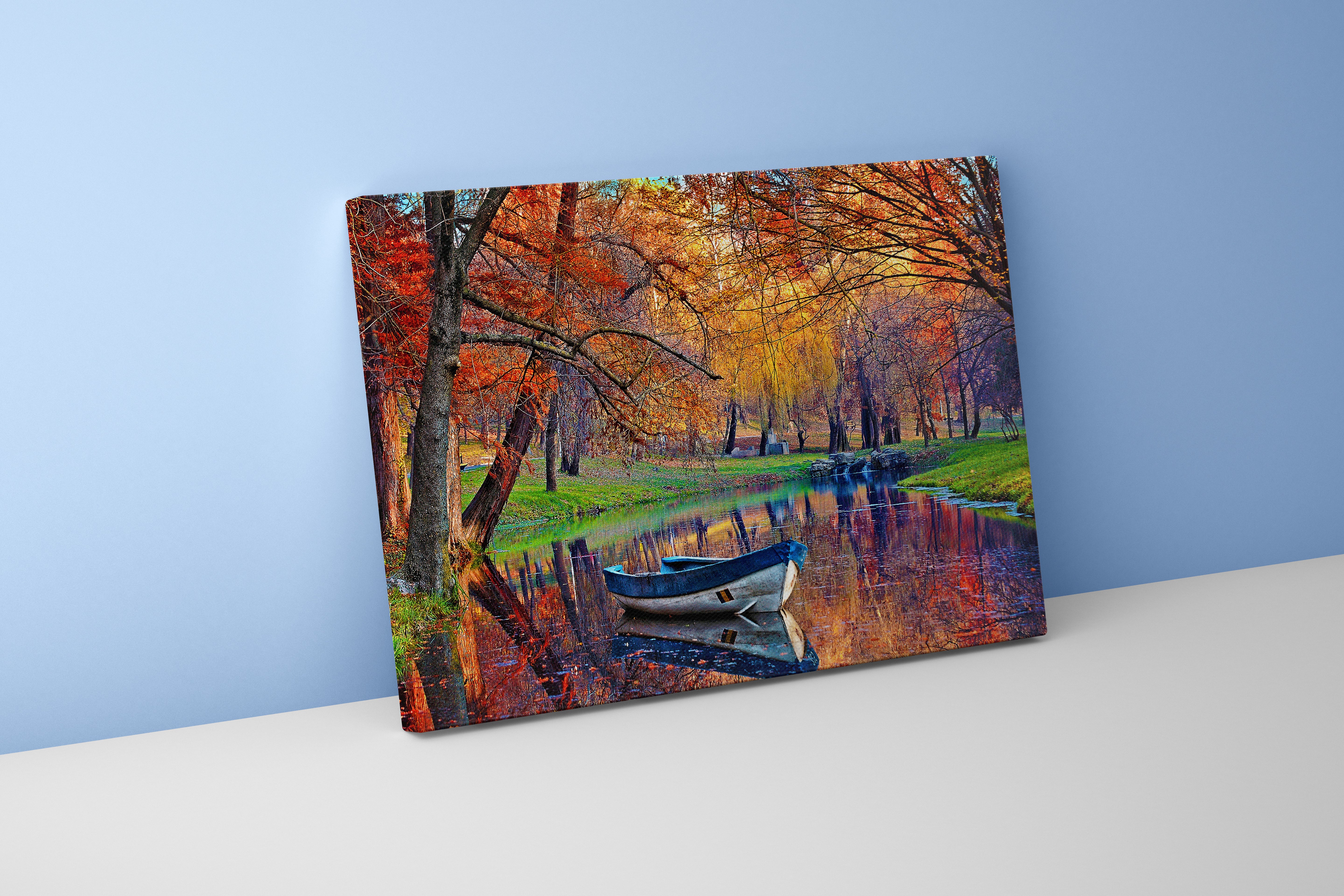 a small boat on a calm river reflecting vibrant autumn colored trees, view, art, kanvas tablo