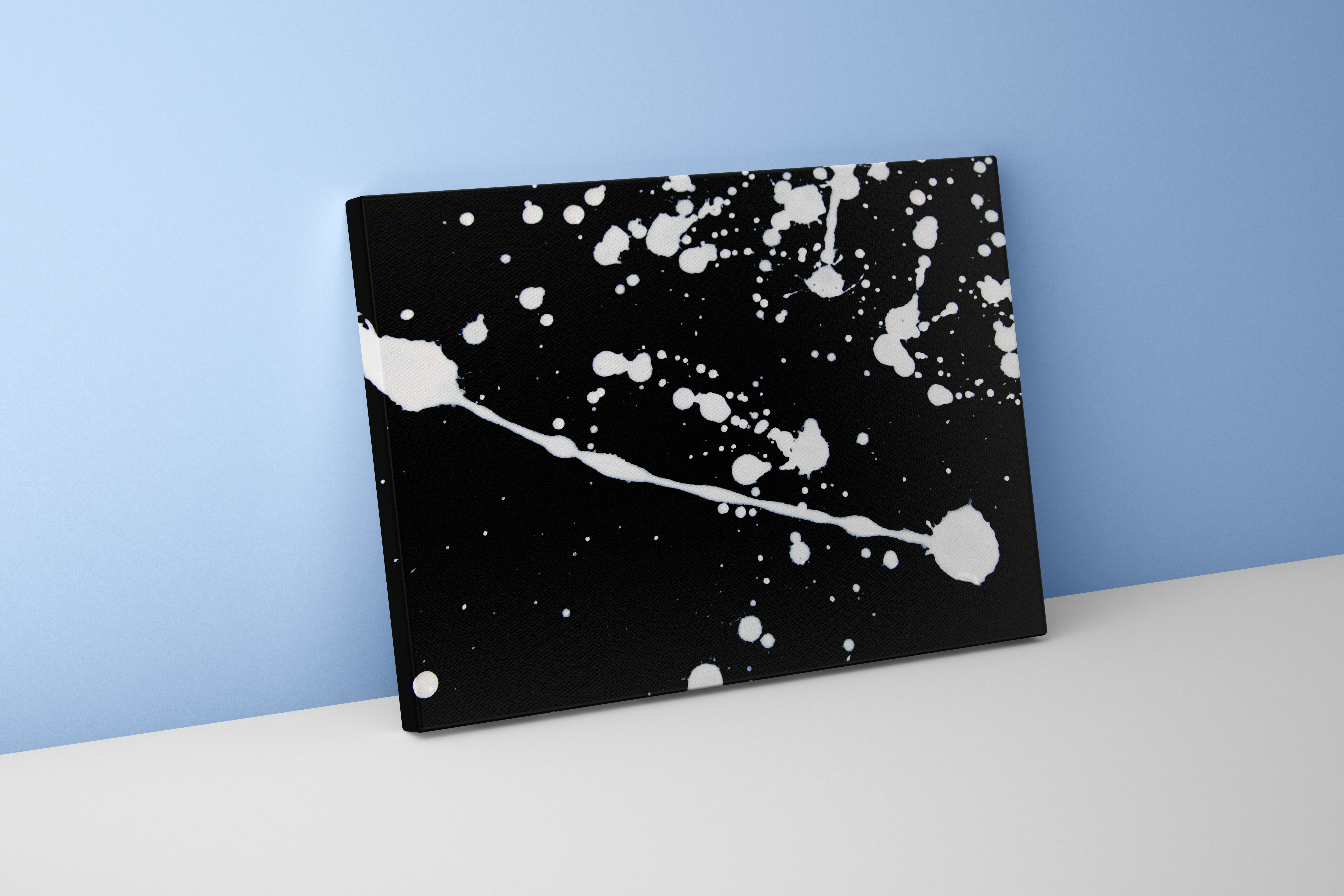 a minimalist abstract artwork with dynamic white paint splatters on a black background, abstract, art, kanvas tablo